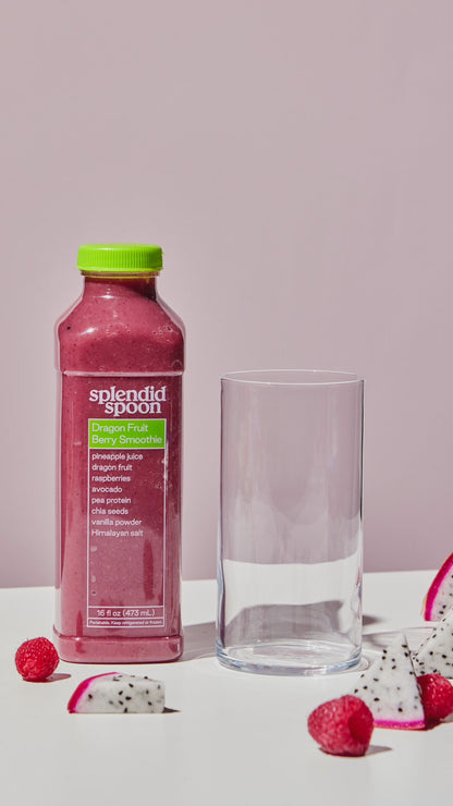 A variety of fruits fall into a glass, and transform into the Dragon Fruit Berry Smoothie
