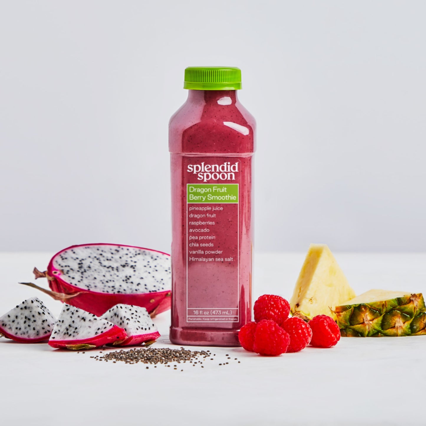 Splendid Spoon Dragon Fruit Berry Smoothie  surrounded by fruits and veggies